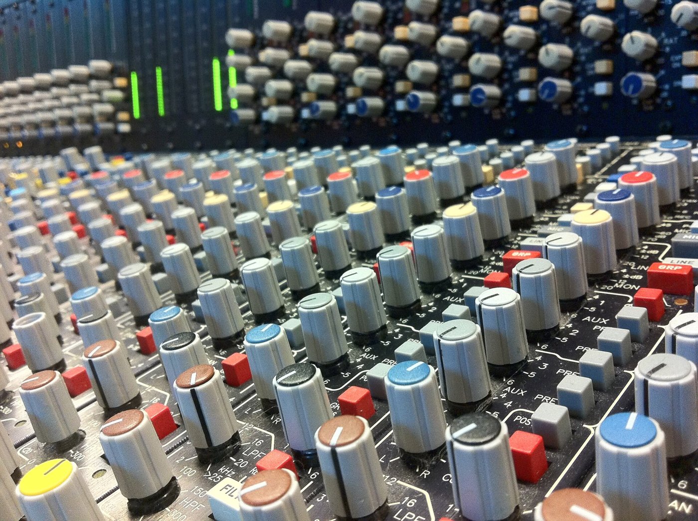 Rows of controls on an audio mixing console