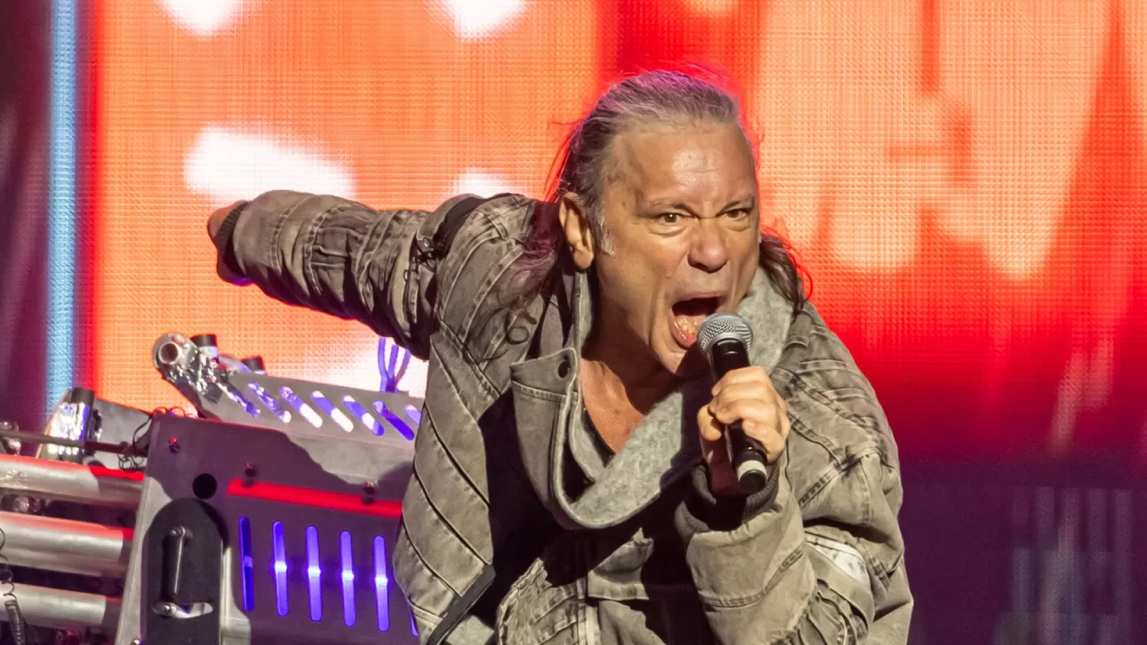 Bruce Dickinson singing into a microphone at Sweden Rock in 2023