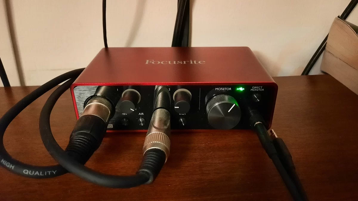 Focusrite Scarlett Solo third-generation audio interface with connected microphone and headphone cables
