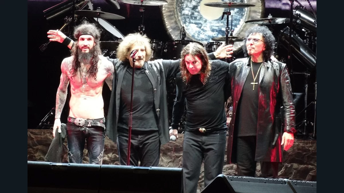 Black Sabbath and fellow musicians bow on stage in Brazil in 2013