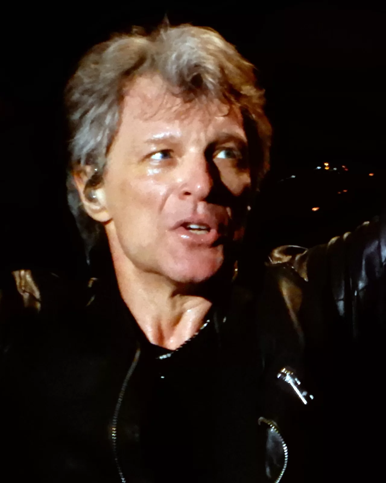 Jon Bon Jovi singing into a microphone at Madison Square Garden in 2017