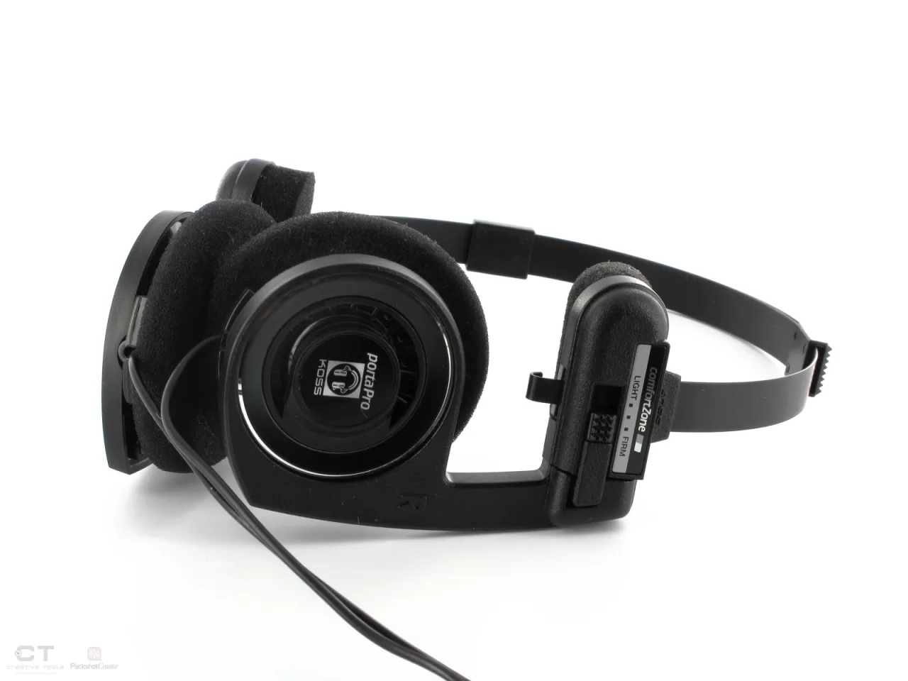 Folded wired Koss Porta Pro headphones showing the foam cushions and Comfort Zone adjustment